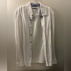 A light airy white comfortable button down top that is worth the wear